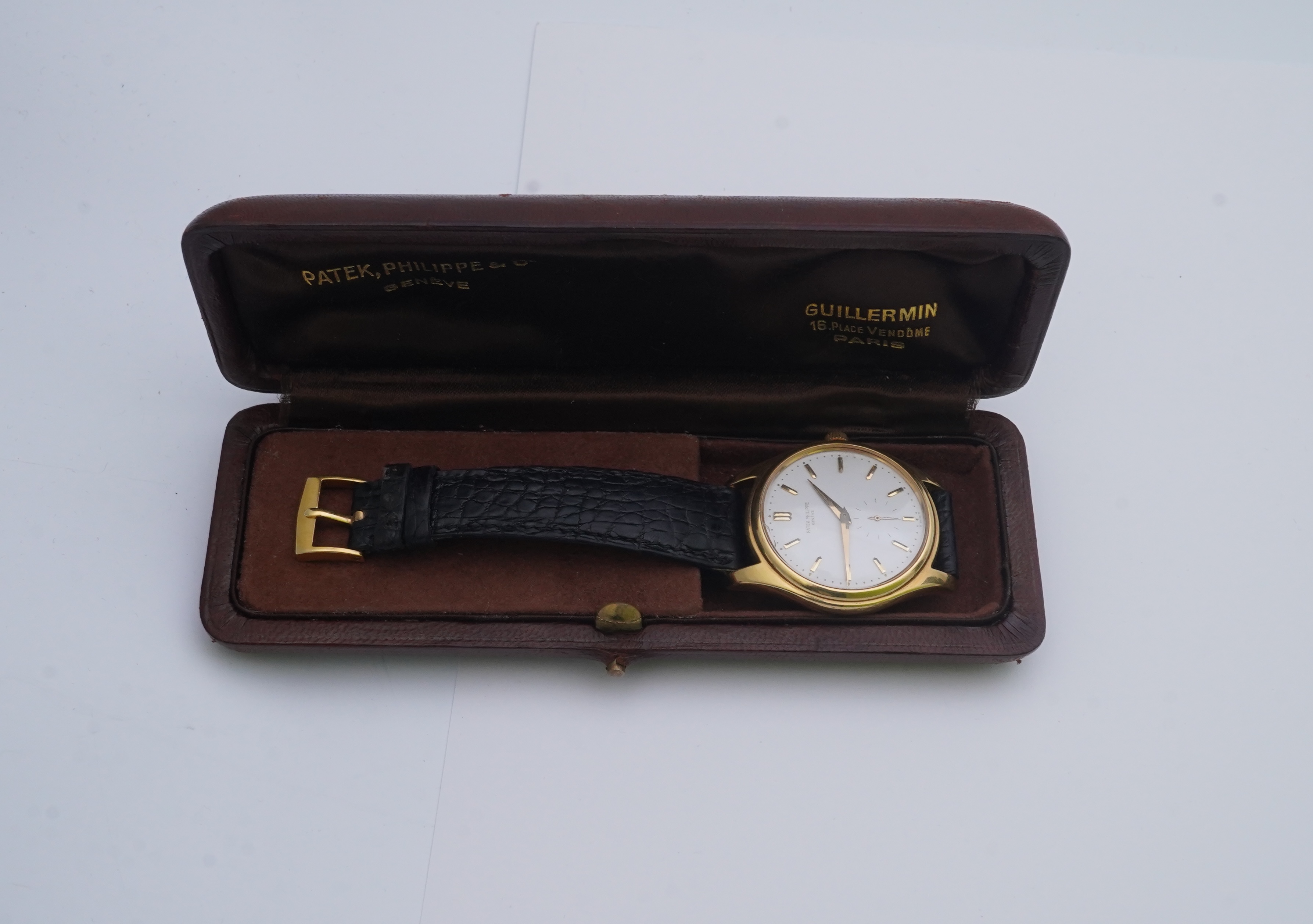 A gentleman's fine 18ct gold Patek Philippe Calatrava automatic wrist watch, model number 2526, on a Patek Philippe black leather strap with a Patek Philippe 18ct gold buckle